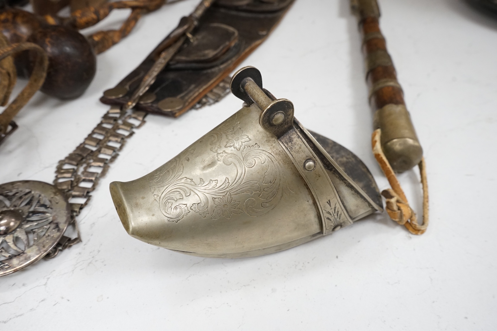 A group of Argentinian Gaucho spurs, bolas, bull whip, daggers and hanger, Longest 100cm